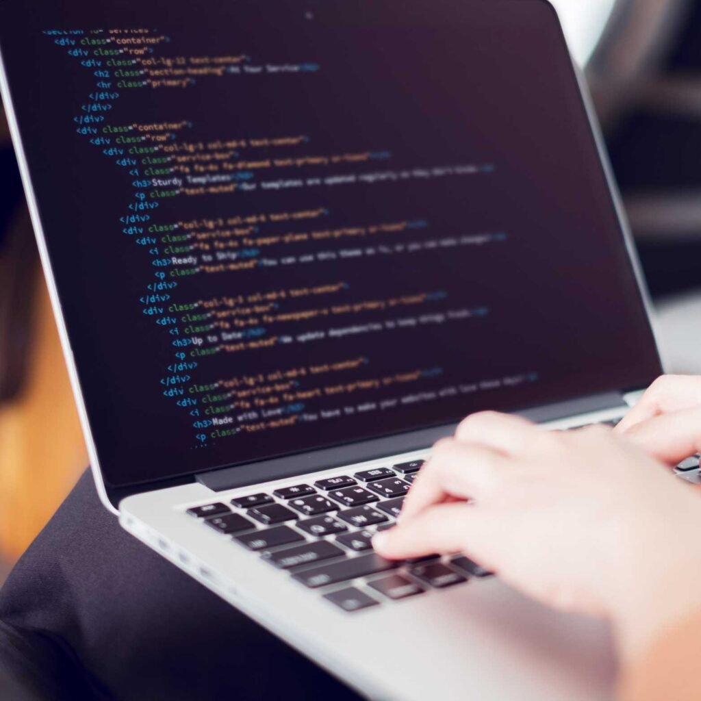 Computer with code on screen